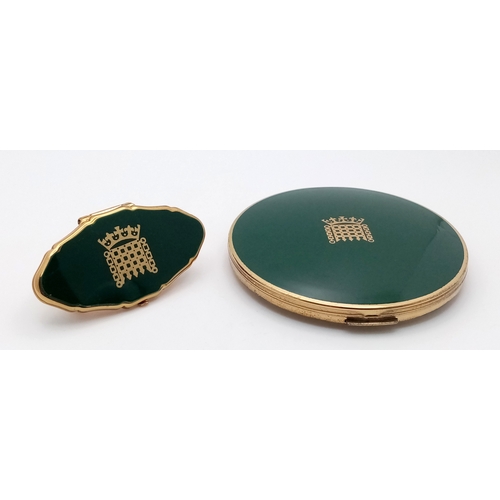 216 - A green enamelled and gilded HOUSE OF LORDS set of a powder compact with mirror and a lipstick case ... 