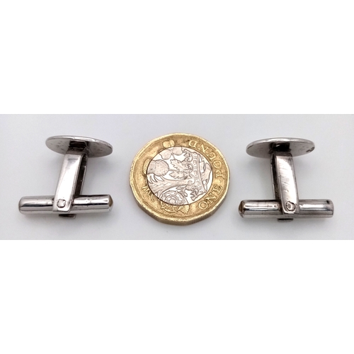 26 - A Pair of 18K White Gold Oval Cufflinks. 9.27g