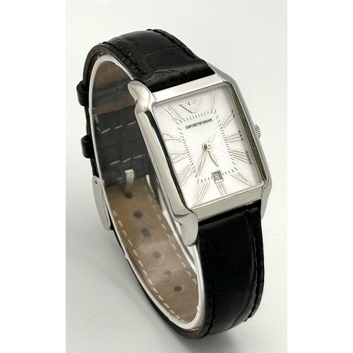 449 - An Emporio Armani Quartz Ladies Watch. Black leather strap. Stainless steel case - 26mm. White dial ... 