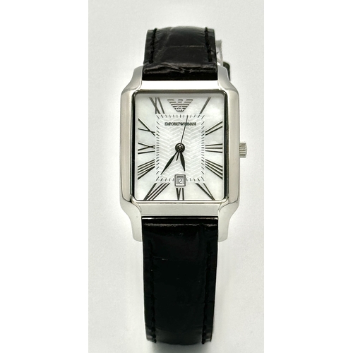 449 - An Emporio Armani Quartz Ladies Watch. Black leather strap. Stainless steel case - 26mm. White dial ... 