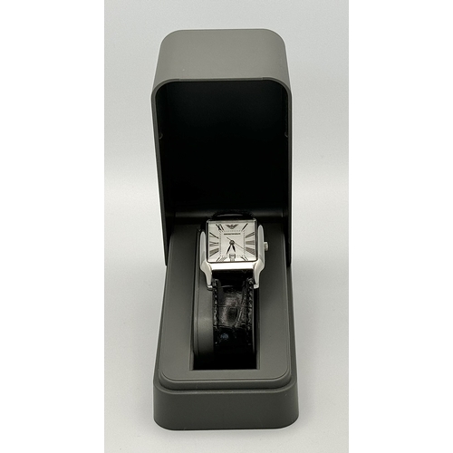 449 - An Emporio Armani Quartz Ladies Watch. Black leather strap. Stainless steel case - 26mm. White dial ... 