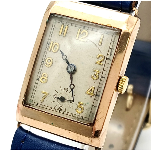 85 - A Charming Vintage (mid 1930s) Gold Cased Watch. Blue leather strap. White dial with second sub dial... 