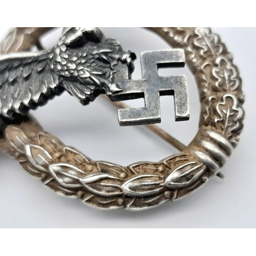 111 - A Third Reich Luftwaffe Pilot's Badge - Makers mark of C.E Juncker. Wingspan 63mm. 43g weight.