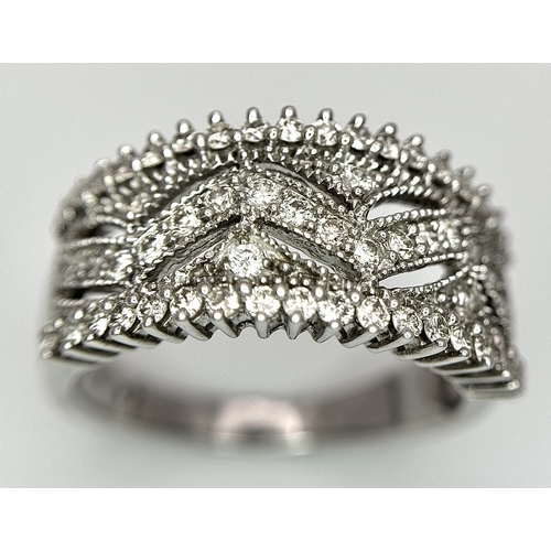 149 - A 9K WHITE GOLD FANCY DIAMOND SET BAND RING 0.75CT 5.6G SIZE P 1/2. Ref: SC 4070