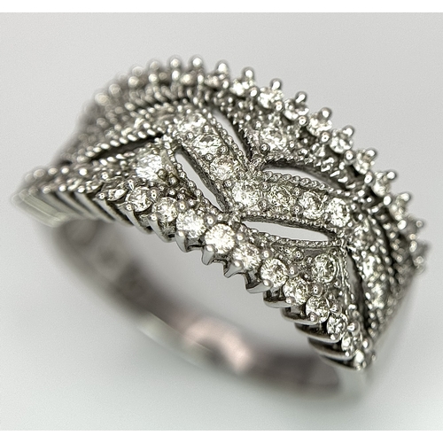 149 - A 9K WHITE GOLD FANCY DIAMOND SET BAND RING 0.75CT 5.6G SIZE P 1/2. Ref: SC 4070