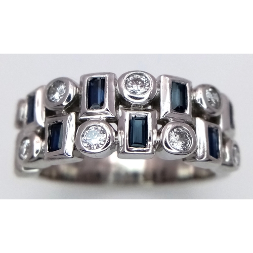 151 - A 9K WHITE GOLD DIAMOND AND SAPPHIRE RING. 6.4G. SIZE M. TAN4001.