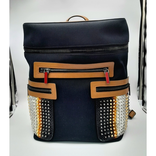 164 - A Christian Louboutin Apoloubi Backpack. Black canvas exterior with brown leather accents and gradie... 