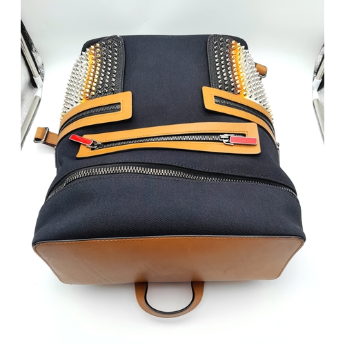 164 - A Christian Louboutin Apoloubi Backpack. Black canvas exterior with brown leather accents and gradie... 