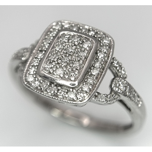 390 - A 9K WHITE GOLD DIAMOND SET RING 0.25CT 3.4G SIZE L. Ref: SC 4014