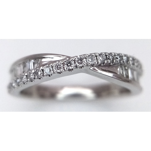 141 - AN 18K WHITE GOLD DIAMOND SET TWIST CROSSOVER RING 0.25CT 3.3G SIZE J. Ref: SC 3058