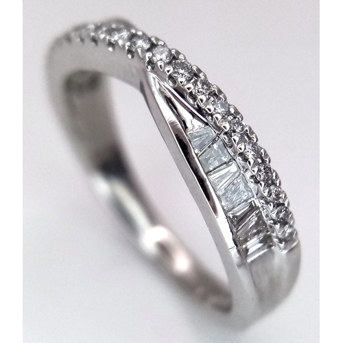 141 - AN 18K WHITE GOLD DIAMOND SET TWIST CROSSOVER RING 0.25CT 3.3G SIZE J. Ref: SC 3058