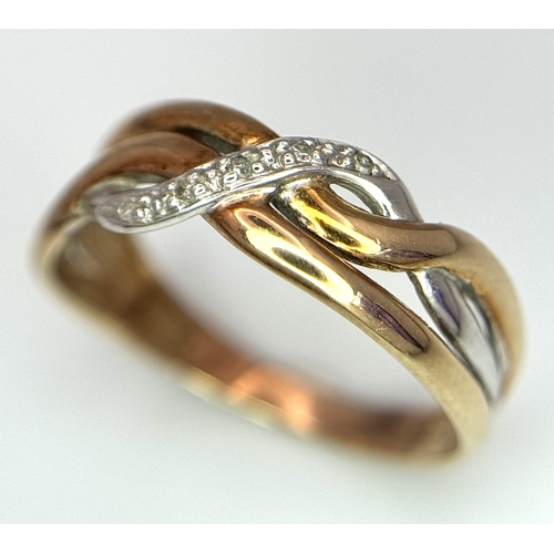 502 - A 9K THREE COLOUR GOLD DIAMOND SET TWIST DESIGN RING. 1.6G TOTAL WEIGHT,  SIZE K. Ref: SC 3001