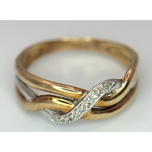 502 - A 9K THREE COLOUR GOLD DIAMOND SET TWIST DESIGN RING. 1.6G TOTAL WEIGHT,  SIZE K. Ref: SC 3001