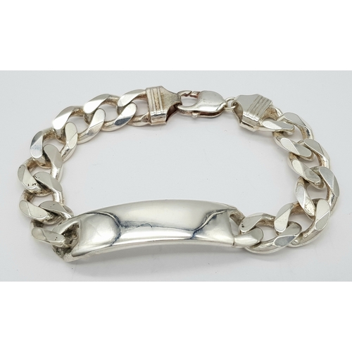 215 - A STERLING SILVER CURB LINK ID BRACELET 64.9G TOTAL WEIGHT, 22CM LENGTH. Ref: TAN 3011