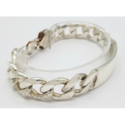 215 - A STERLING SILVER CURB LINK ID BRACELET 64.9G TOTAL WEIGHT, 22CM LENGTH. Ref: TAN 3011