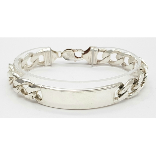 215 - A STERLING SILVER CURB LINK ID BRACELET 64.9G TOTAL WEIGHT, 22CM LENGTH. Ref: TAN 3011