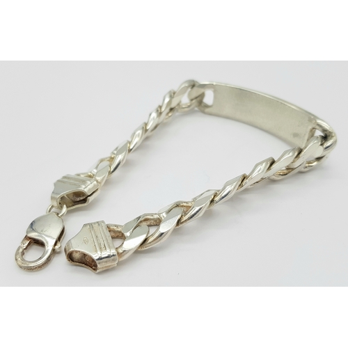 215 - A STERLING SILVER CURB LINK ID BRACELET 64.9G TOTAL WEIGHT, 22CM LENGTH. Ref: TAN 3011