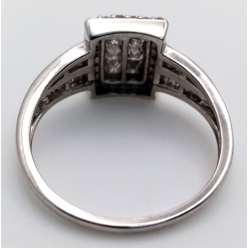 229 - A 9K WHITE GOLD DIAMOND CLUSTER RING 0.65CT , 3.2G TOTAL WEIGHT, SIZE P 1/2. Ref: 7042