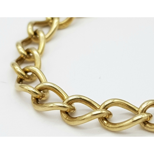 214 - A 9k yellow gold charm bracelet. 15.1g total weight. 18cm total length. 18321-1