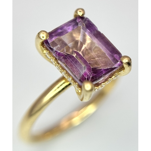 228 - An 18k yellow gold diamond and amethyst ring. 0.1ct diamond. 2.25ct amethyst. 3.5g total weight. siz... 