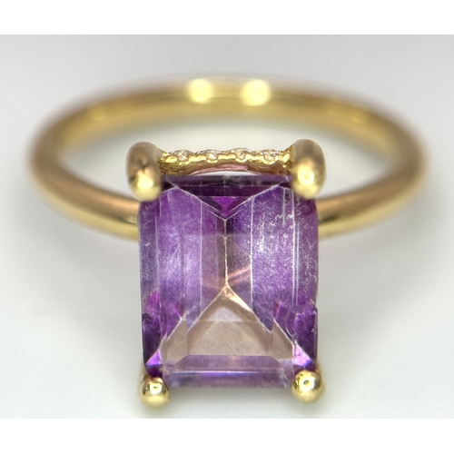 228 - An 18k yellow gold diamond and amethyst ring. 0.1ct diamond. 2.25ct amethyst. 3.5g total weight. siz... 