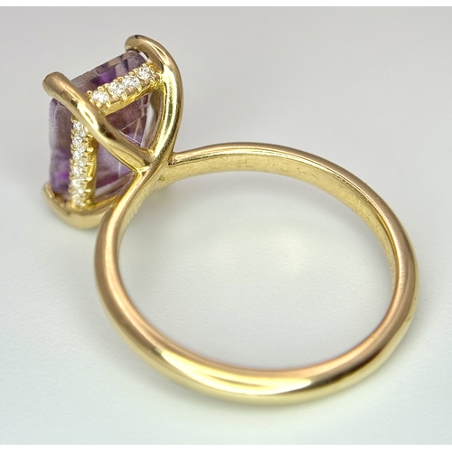 228 - An 18k yellow gold diamond and amethyst ring. 0.1ct diamond. 2.25ct amethyst. 3.5g total weight. siz... 