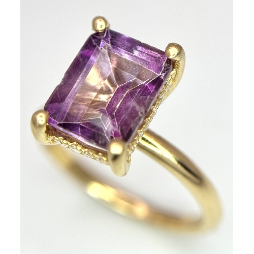 228 - An 18k yellow gold diamond and amethyst ring. 0.1ct diamond. 2.25ct amethyst. 3.5g total weight. siz... 