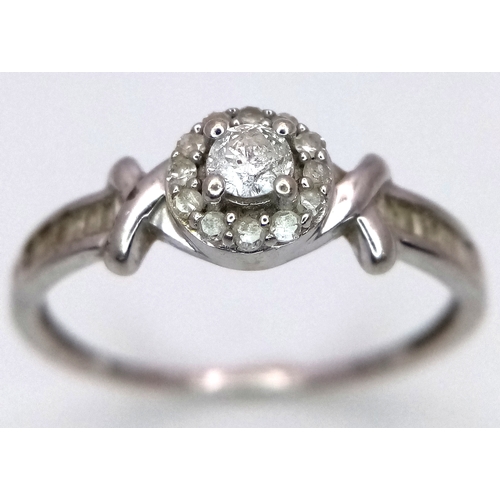 29 - A 10K White Gold Diamond Ring. 0.33ctw of round and baguette cut diamonds. Comes with certificates. ... 