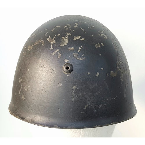 152 - A WW2 Italian Fascist Black shirt M33 Black Helmet with Hand Painted Eagle. With liner and chip stra... 