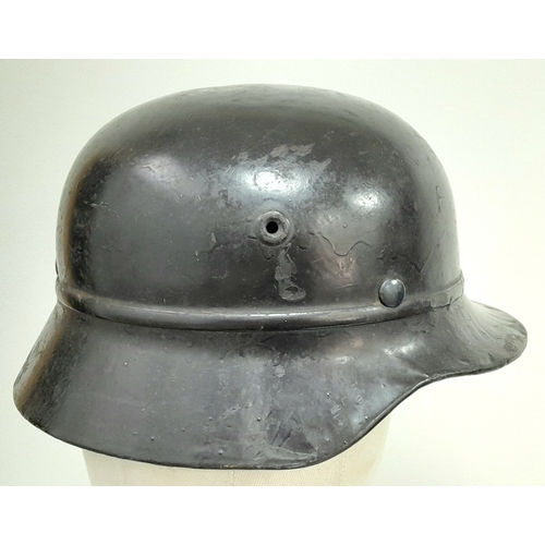 180 - A 3rd Reich M35 Beaded Civic Auxiliary Helmet with chin strap and liner.