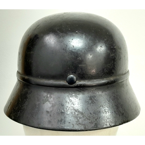 180 - A 3rd Reich M35 Beaded Civic Auxiliary Helmet with chin strap and liner.