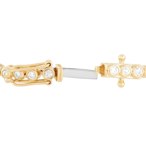 100 - An 18K Yellow Gold 1.92ct Diamond Evil Eye Bracelet. Diamonds totaling 1.92 carats shimmer and shine... 