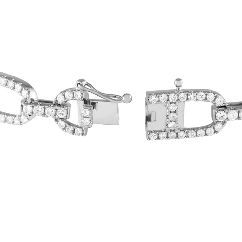 137 - An 18K White Gold 3.52ct Diamond Link Bracelet. It features diamond-traced links shaped like the Gre... 