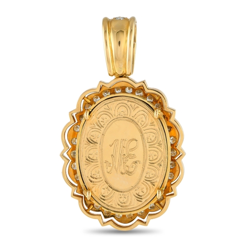 166 - An 18K Yellow Gold 1.50ct Diamond Pendant. Religious imagery serves as a striking focal point at the... 