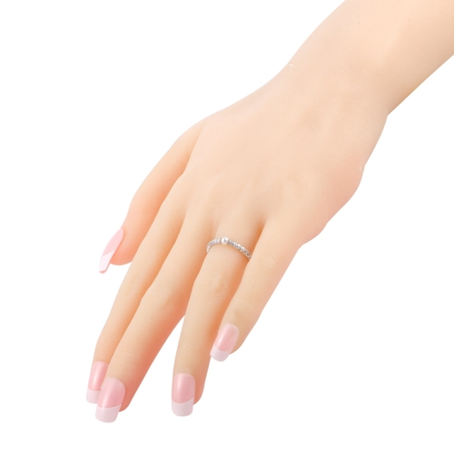 231 - A Mikimoto 18K White Gold Diamond and 3.0-3.5mm Akoya Pearl Band Ring. Embrace a sense of utmost fem... 