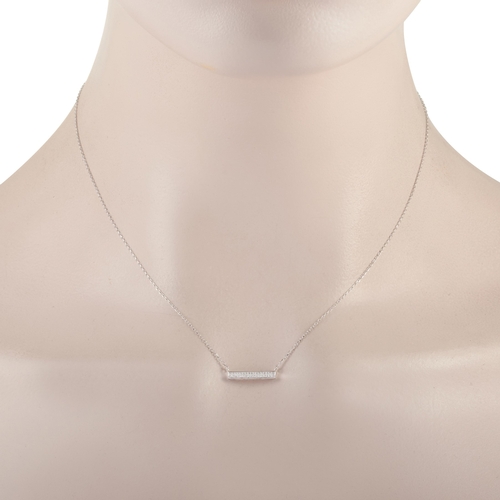 283 - A 14K White Gold 0.10 ct Diamond Pendant Necklace. This necklace is crafted from 14K white gold and ... 