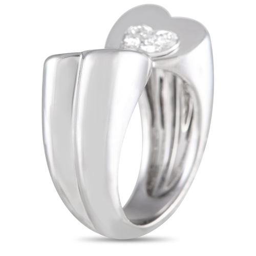 89 - A Fred of Paris 18K White Gold Diamond Twin Hearts Ring. A modern band in polished white gold fitted... 