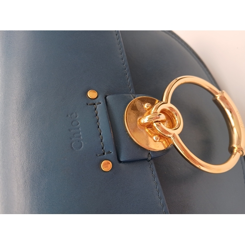 263 - A Chloé Blue Leather Tess Bag. Blue leather exterior with gold-toned hardware, top handle, detachabl... 