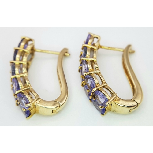 278 - A PAIR OF 9K YELLOW GOLD TANZANITE SET EARRINGS - 4.1G TOTAL WEIGHT. JB7100