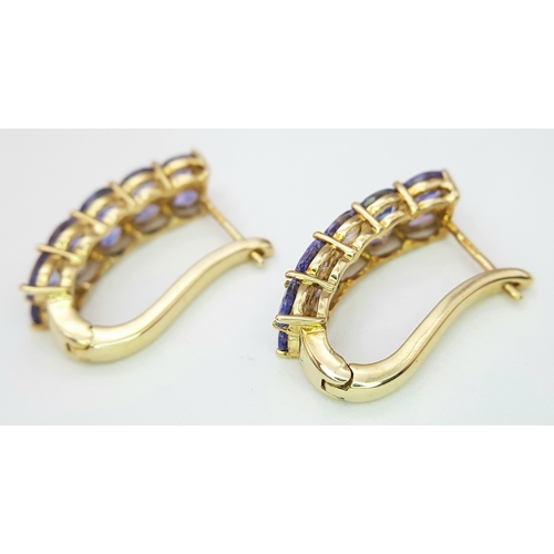 278 - A PAIR OF 9K YELLOW GOLD TANZANITE SET EARRINGS - 4.1G TOTAL WEIGHT. JB7100