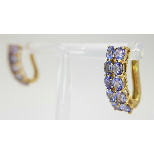 278 - A PAIR OF 9K YELLOW GOLD TANZANITE SET EARRINGS - 4.1G TOTAL WEIGHT. JB7100