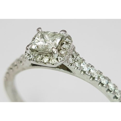 292 - A 9K WHITE GOLD DIAMOND SET HALO RING - 0.50CT. 2.3G SIZE P. A/S1214