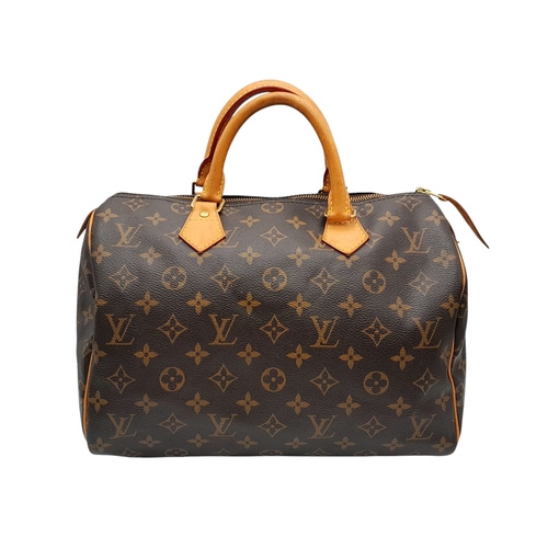 396 - A Louis Vuitton Monogram Canvas Speedy 30 Bag. Brown coated canvas exterior with gold-toned hardware... 