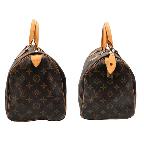 396 - A Louis Vuitton Monogram Canvas Speedy 30 Bag. Brown coated canvas exterior with gold-toned hardware... 