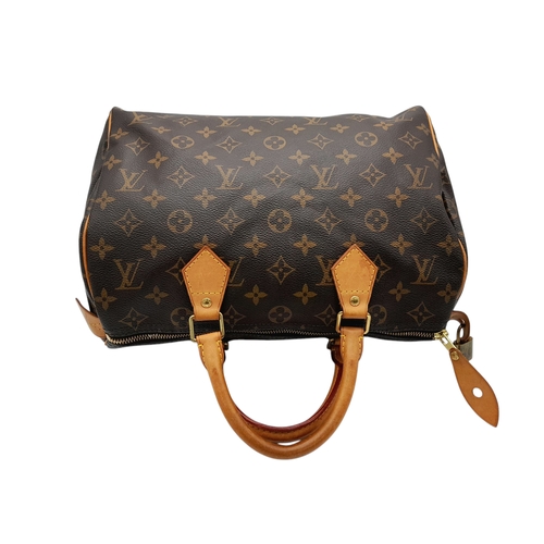 396 - A Louis Vuitton Monogram Canvas Speedy 30 Bag. Brown coated canvas exterior with gold-toned hardware... 