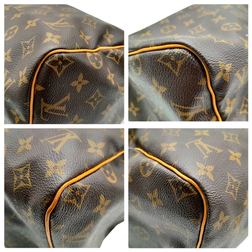 396 - A Louis Vuitton Monogram Canvas Speedy 30 Bag. Brown coated canvas exterior with gold-toned hardware... 