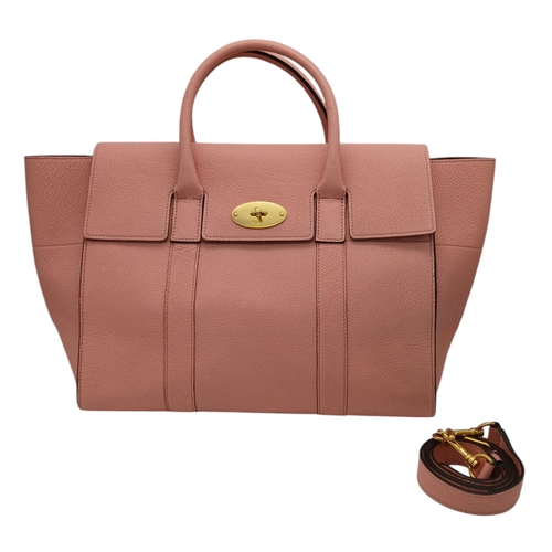 494 - A Mulberry Pink Leather Bayswater Bag. Pink leather exterior with gold-toned hardware, magnetic clos... 