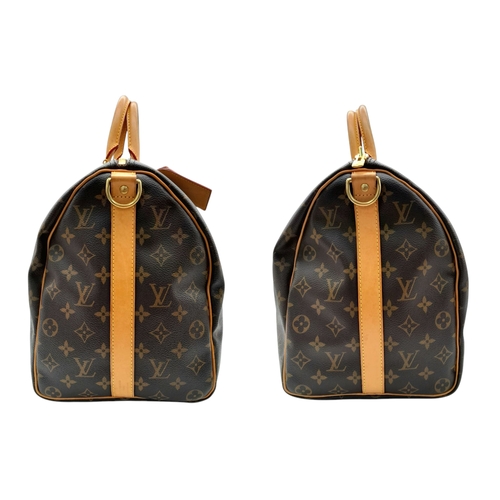 116 - A Louis Vuitton Monogram Canvas Keepall Bag. Brown coated canvas exterior with natural leather trim,... 