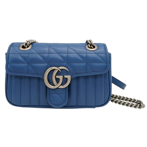 32 - A Gucci Blue Matelassé Leather GG Marmont Shoulder Bag. Blue matelassé leather exterior with silver-... 