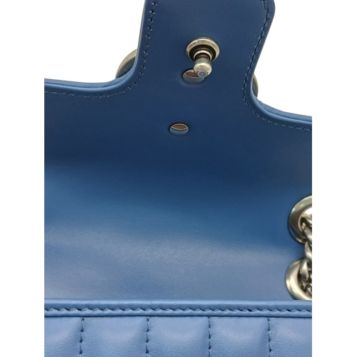 32 - A Gucci Blue Matelassé Leather GG Marmont Shoulder Bag. Blue matelassé leather exterior with silver-... 